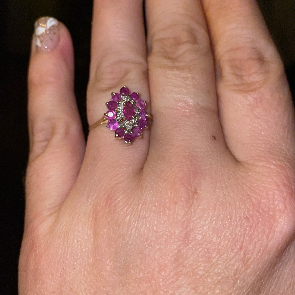 Beautiful genuine ruby and diamond ring it is 14 k solid gold and a size 7